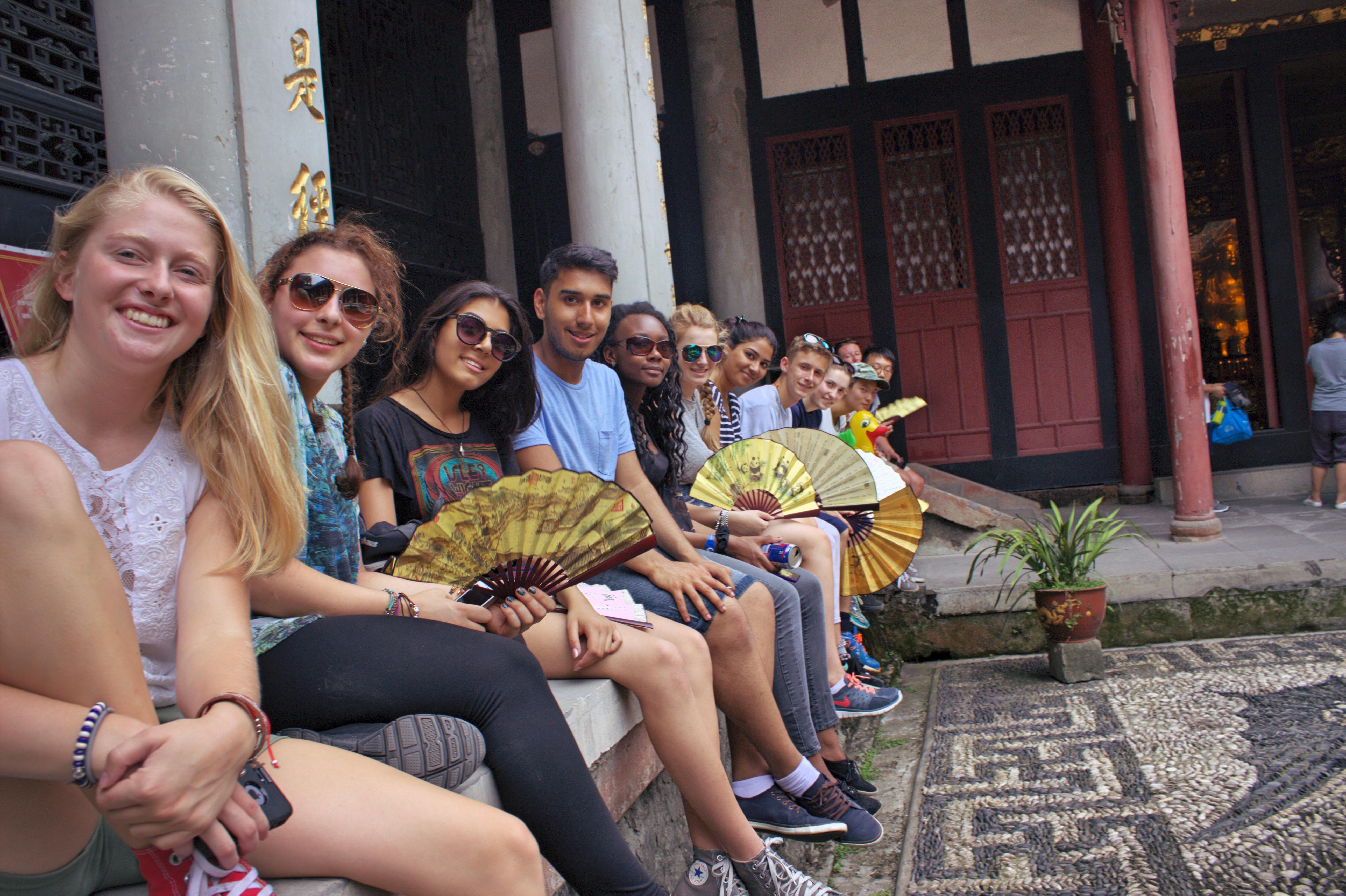 A group of Projects Abroad teenage volunteers working with children in China, visit a temple during a weekend trip. Volunteers doing teenage community work in China, visit a temple over the weekend.